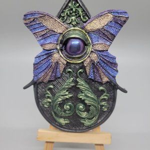 Purple and green Over seeing decor planchette